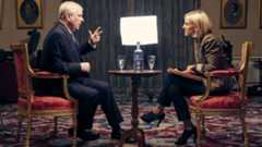 Andrew Mountbatten-Windsor sits in a suit, being interview by Emily Maitlis