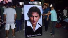 A poster of Indian singer-composer Zubeen Garg, surrounded by fans in Assam's Nagaon town, paying tributes after the news of his death broke out on 19 September