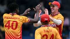 Zimbabwe's Blessing Muzarabani celebrates taking the wicket of Australia's Josh Inglis with his team-mates