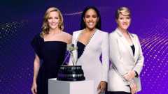 Sports Personality of the Year presenters Gabby Logan, Alex Scott and Clare Balding stand behind the trophy