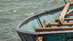 Old rusty fishing boat with flaking paint on the bank of the Nile in Sudan
