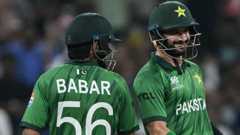 Pakistan's Sahibzada Farhan (right) and Babar Azam run between the wickets during the 2026 ICC Men's T20 Cricket World Cup group stage match between Pakistan and USA