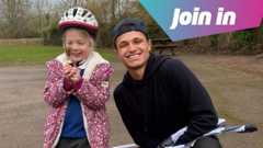 Lando Norris with one of the scooter race winners