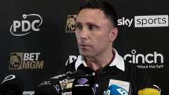 Gerwyn Price speaks to the media