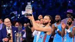 Steph Curry holding the 2025 NBA All-Star's Most Valuable Player award