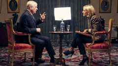 Andrew Mountbatten-Windsor sits in a suit, being interview by Emily Maitlis