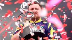 Luke Littler with trophy