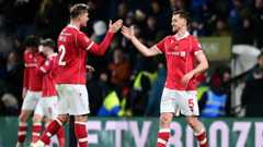 Wrexham's Dominic Hyam celebrates with team-mate Callum Doyle at the final whistle during the Emirates FA Cup Fourth Round match between Wrexham and Ipswich Town