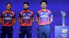 Nepal cricket team players stand beside T20 WC trophy