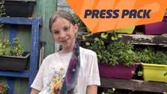 A girl in front of plants