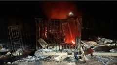 Night shot of the aftermath following an attack on a village