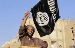 A militant islamist fighter takes part in an ISIS parade in Syria's eastern city of Raqqa June 30 2014