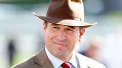 Peter Phillips in brown suit and matching hat