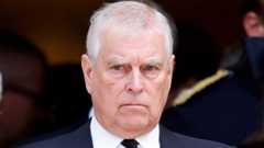 Prince Andrew in a dark suit and tie with a white shirt
