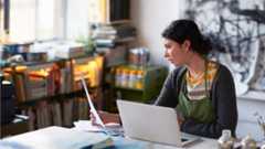 Woman sitting at laptop