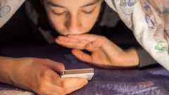 Teenager using a smartphone