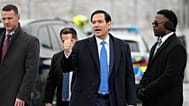 U.S. Secretary of State Marco Rubio gives a thumbs up as he departs Munich International Airport in Munich, Germany