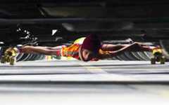 Deshna Nahar limbo skating under twenty cars