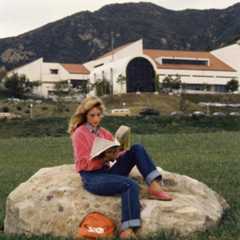 vintage 1980s photo of student reading from the University Archives Collection
