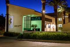 Student performing in front of packed house in the Surfboard Room