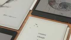 A photo of digital notebooks on a table, including the Boox Note Max, Boox Note Air 4C, and Viwoods AiPaper