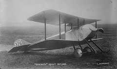 Photo shows a biplane on the ground.