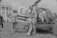 Photo shows the president about to step into a United States Air Force helicopter with the White House in the background.
