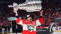 Brad Marchand lifts Stanley Cup again after 14 years