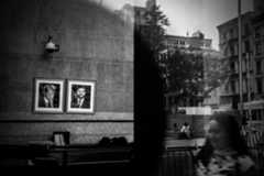 Portraits of President Donald Trump and VicePresident J. D. Vance hang on a wall.