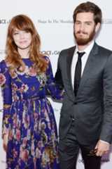 Image may contain Andrew Garfield Tie Accessories Accessory Human Person Coat Clothing Overcoat Apparel and Suit