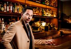 Image may contain Nick Kroll Pub Bar Counter Human Person Worker Bottle Drink Alcohol Beverage and Bartender