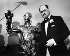 John Williams poses with C3P0 after the Boston Pops on April 29 1980.