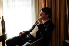 Image may contain Clothing Apparel Human Person Suit Coat and Overcoat