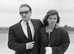 Image may contain Tie Accessories Accessory Clothing Apparel Ali Hewson Suit Coat Overcoat Human Person and Bono