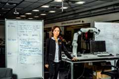 Image may contain FeiFei Li Human Person Furniture Table Chair and Desk