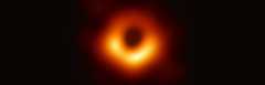 Black hole at M87*; a red/orange circle, thicker at the bottom with a black center; the entire circle is on a black background