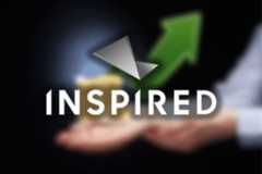 Inspired Entertainment reports strong Q3 2025 growth driven by digital expansion. Hands holding a small stack of coins with a large green upward arrow in the background and the Inspired Entertainment logo overlaid.