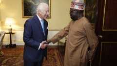 King Charles III shakes hands with Nigeria's President Bola Ahmed Tinubu, during an audience at Buckingham Palace in central London on September 11, 2024.