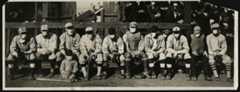 The Pasadena Merchants winter league team poses for a photo with umpire John "Beans" Reardon, second from right, during the "flu mask" baseball game on January 26, 1919. Among the players on Pasadena's roster were Emil “Irish” Meusel of the Philadelphia Phillies, Fred McMullin and Frank Shellenback of the Chicago White Sox, George Cutshaw of the Pittsburgh Pirates, and Pete Schneider and Red Killefer of the Cincinnati Reds. The players' exact order in this photo is unknown. (RMY Auctions)