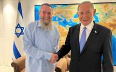 MK Avi Maoz, left, and Likud head Benjamin Netanyahu after signing a coalition deal on November 27, 2022. (Courtesy, Likud) MK Avi Maoz, left, and Likud head Benjamin Netanyahu after signing a coalition deal on November 27, 2022. (Courtesy, Likud)