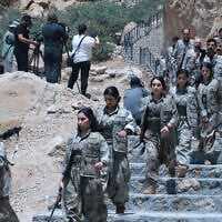 Fighters with the Kurdistan Workers' Party (PKK) descend stairs ahead of a ceremony in Sulaimaniyah, in Iraq's autonomous Kurdistan region, on July 11, 2025. (Shwan MOHAMMED / AFP) Fighters with the Kurdistan Workers' Party (PKK) descend stairs ahead of a ceremony in Sulaimaniyah, in Iraq's autonomous Kurdistan region, on July 11, 2025. (Shwan MOHAMMED / AFP)