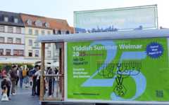 A sign advertises the Yiddish Summer Weimar festival on Weimar's market square, eastern Germany, on August 17, 2025. (Jastinder KHERA / AFP) A sign advertises the Yiddish Summer Weimar festival on Weimar's market square, eastern Germany, on August 17, 2025. (Jastinder KHERA / AFP)