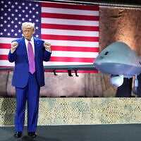 US President Donald Trump gestures backdropped by an MQ-9 Reaper drone at the Al Udeid Air Base, Thursday, May 15, 2025, in Doha, Qatar. (AP Photo/Alex Brandon) US President Donald Trump gestures backdropped by an MQ-9 Reaper drone at the Al Udeid Air Base, Thursday, May 15, 2025, in Doha, Qatar. (AP Photo/Alex Brandon)