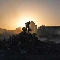 Palestinians search for goods at a landfill in Gaza City, October 25, 2025. (AP Photo/Abdel Kareem Hana) Palestinians search for goods at a landfill in Gaza City, October 25, 2025. (AP Photo/Abdel Kareem Hana)