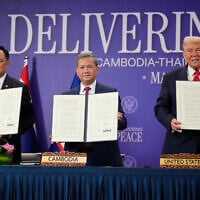 US President Donald Trump, Cambodian Prime Minister Hun Manet, left, and Thailand's Prime Minister Anutin Charnvirakul pose with their documents during a signing ceremony on the sidelines of the ASEAN Summit in Kuala Lumpur, Malaysia, October 26, 2025. (AP Photo/Mark Schiefelbein) US President Donald Trump, Cambodian Prime Minister Hun Manet, left, and Thailand's Prime Minister Anutin Charnvirakul pose with their documents during a signing ceremony on the sidelines of the ASEAN Summit in Kuala Lumpur, Malaysia, October 26, 2025. (AP Photo/Mark Schiefelbein)