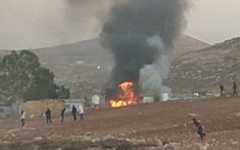 A burning home, allegedly torched by settlers, at the Bedouin community of al-Ara'ara, near Mukhmas, west of Ramallah, in the West Bank, October 25, 2025. (Courtesy/Torat Tzedek) A burning home, allegedly torched by settlers, at the Bedouin community of al-Ara'ara, near Mukhmas, west of Ramallah, in the West Bank, October 25, 2025. (Courtesy/Torat Tzedek)
