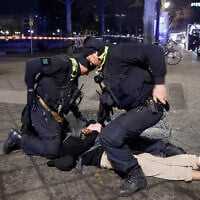 Police apprehend a suspect at the scene where a person was stabbed near the memorial of the murdered Jews of Europe in Berlin on February 21, 2025. (Odd ANDERSEN / AFP) Police apprehend a suspect at the scene where a person was stabbed near the memorial of the murdered Jews of Europe in Berlin on February 21, 2025. (Odd ANDERSEN / AFP)