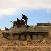 Fighters from the Syrian Democratic Forces (SDF) sit atop an armoured personnel carrier on the outskirts of the town of al-Shadadi in the northeastern Syrian province of Hasakeh, on February 19, 2016. (Delil souleiman / AFP) Fighters from the Syrian Democratic Forces (SDF) sit atop an armoured personnel carrier on the outskirts of the town of al-Shadadi in the northeastern Syrian province of Hasakeh, on February 19, 2016. (Delil souleiman / AFP)