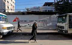 Palestinians walk past the clinic of Doctors Without Borders or Medecins Sans Frontieres (MSF), in the al-Rimal neighborhood of Gaza City on January 11, 2026. (Omar AL-QATTAA / AFP) Palestinians walk past the clinic of Doctors Without Borders or Medecins Sans Frontieres (MSF), in the al-Rimal neighborhood of Gaza City on January 11, 2026. (Omar AL-QATTAA / AFP)