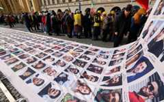 Protesters display a banner featuring portraits of alleged victims of the Iranian government during a demonstration against the Iranian government called by the People's Mujahedin of Iran (MEK), in Munich, southern Germany, on the sidelines of the 62nd Munich Security Conference (MSC) on February 13, 2026. (Michaela STACHE / AFP) Protesters display a banner featuring portraits of alleged victims of the Iranian government during a demonstration against the Iranian government called by the People's Mujahedin of Iran (MEK), in Munich, southern Germany, on the sidelines of the 62nd Munich Security Conference (MSC) on February 13, 2026. (Michaela STACHE / AFP)